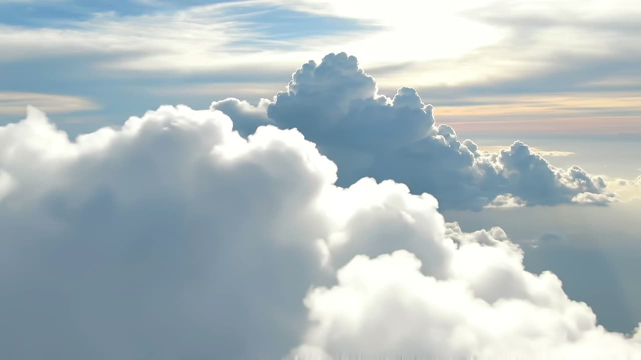 Soft clouds drifting across a bright sky